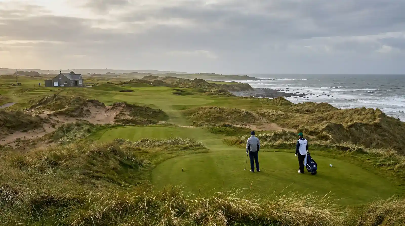 Coastal links golf course with undulating fairways and sand dunes beside the sea