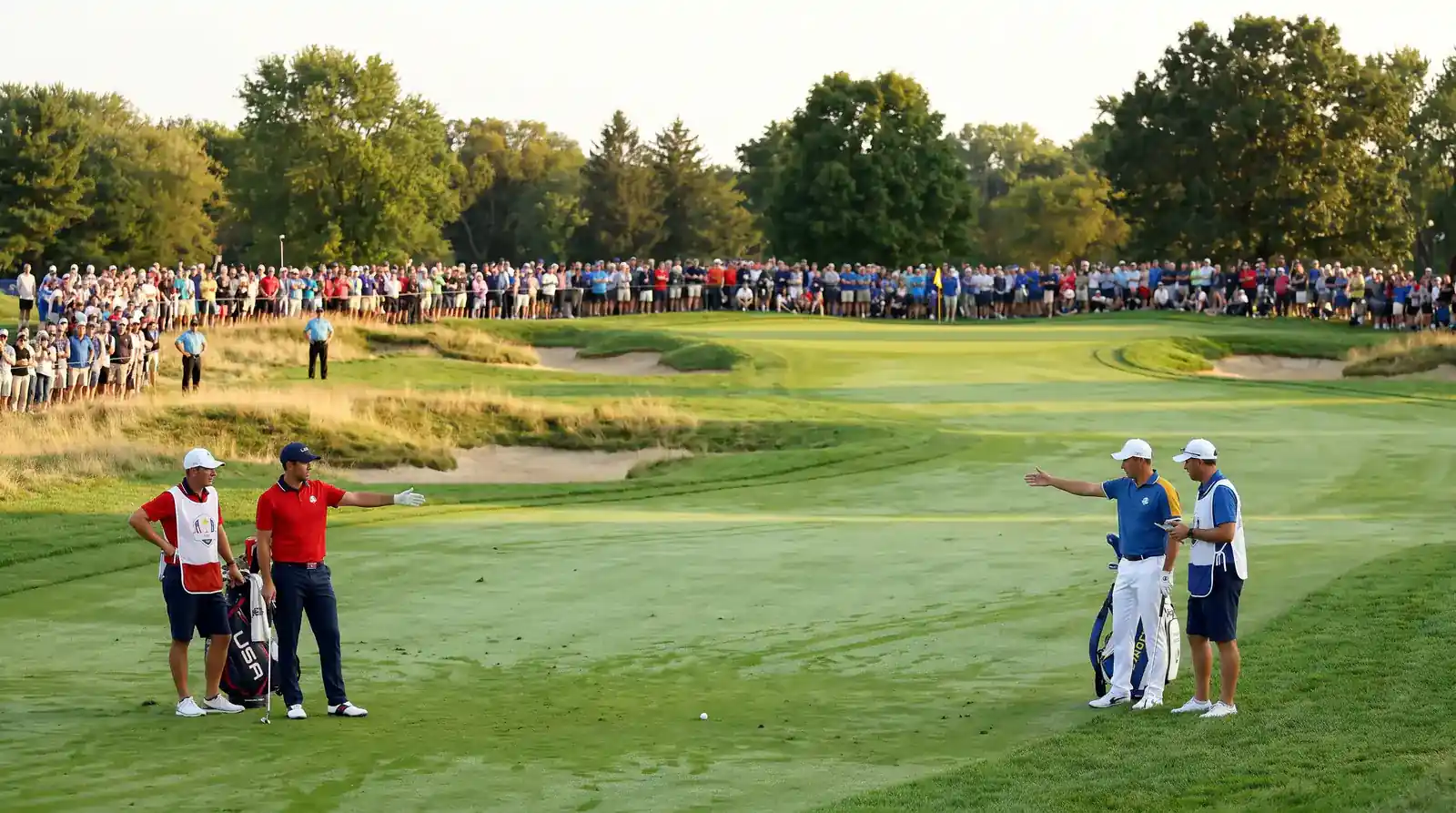 Sunday singles match at the Ryder Cup with intense one-on-one competition on the fairway